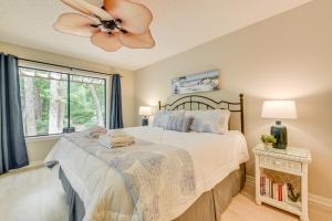a bedroom with a bed and a ceiling fan at Private Deck & Pool Access: Myrtle Beach Getaway! in Myrtle Beach +32 photos