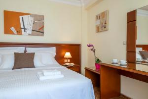Postel nebo postele na pokoji v ubytování Porto Alegre Hotel