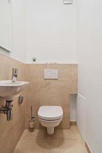 a bathroom with a toilet and a sink at Stylish 2BR Apt in Limpertsberg, Near City Center in Luxembourg +21 photos