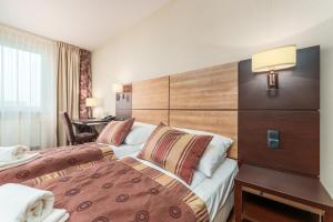 Ένα ή περισσότερα κρεβάτια σε δωμάτιο στο Baltic Wave +19 φωτογραφίες