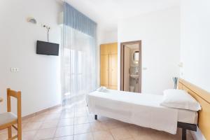 Postel nebo postele na pokoji v ubytování Hotel Katina