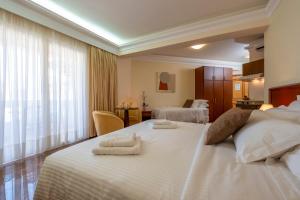 Postel nebo postele na pokoji v ubytování Porto Alegre Hotel