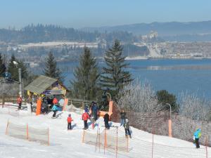 a group of people on a ski slope in the snow at Polana Sosny in Niedzica Zamek