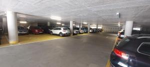 a parking garage filled with lots of parked cars at Studio apartma Plaža in Portorož