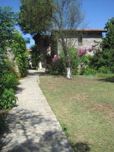 a stone path in front of a house at Doga Apartments in Kayakoy