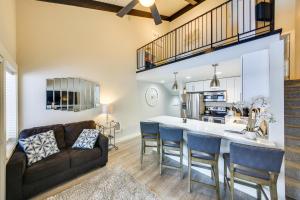 a kitchen and living room with a couch and a table at Waterfront Sandpoint Condo Lake Access! in Sandpoint
