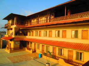 a large building with balconies on top of it at Hotel Mediterraneo in Canoa
