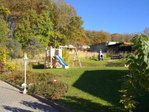 a park with a playground and a swing set at Residenz Binz by Rujana in Binz