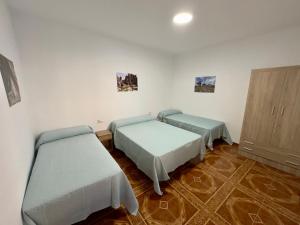 Postel nebo postele na pokoji v ubytování Vivienda Rural La Atalaya