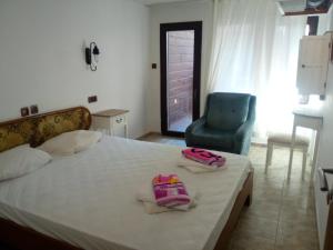 Postel nebo postele na pokoji v ubytování Rony Hotel