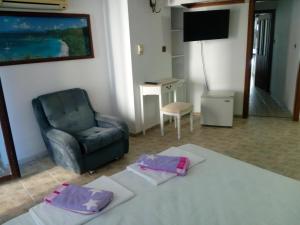 Postel nebo postele na pokoji v ubytování Rony Hotel