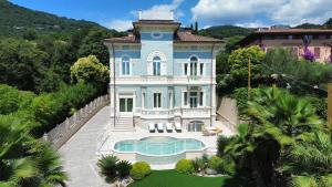 an aerial view of a large blue house at Villa Diamante Top Luxury-BGL in Salò