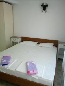Postel nebo postele na pokoji v ubytování Rony Hotel