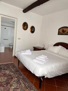 Postel nebo postele na pokoji v ubytování Cascina Bella Relais