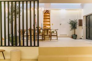 a living room with a table and chairs at Spacious LOFT with SPA - 4BR-8P - Montmartre in Paris +64 photos