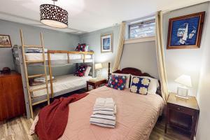 a bedroom with a bed and a bunk bed at Bayview in Truro