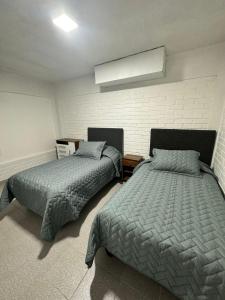 Postel nebo postele na pokoji v ubytování Hostal Jailoren