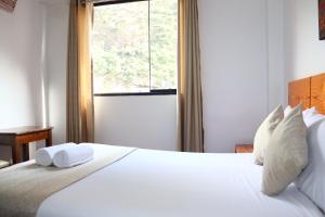 Letto o letti in una camera di Fenix Hotel Machupicchu
