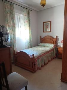 Ένα ή περισσότερα κρεβάτια σε δωμάτιο στο Casa Mar Baltico a 200 m de la Playa La Barrosa