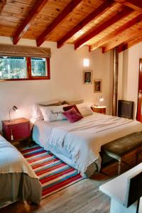 Voodi või voodid majutusasutuse El Bosque 2 Casa en Cerro Otto, Bariloche toas