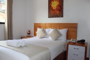Letto o letti in una camera di Fenix Hotel Machupicchu