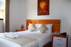 Letto o letti in una camera di Fenix Hotel Machupicchu