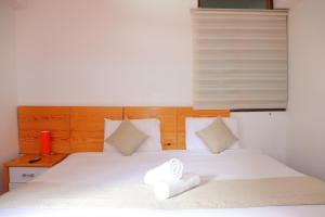 Letto o letti in una camera di Fenix Hotel Machupicchu