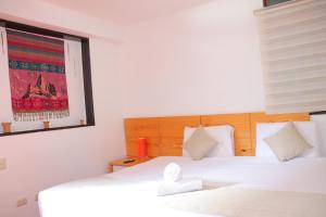 Letto o letti in una camera di Fenix Hotel Machupicchu