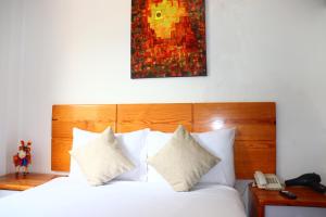 Letto o letti in una camera di Fenix Hotel Machupicchu