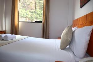 Letto o letti in una camera di Fenix Hotel Machupicchu