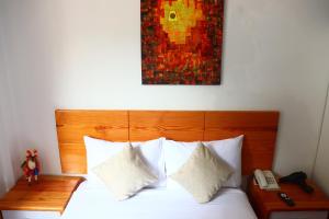 Letto o letti in una camera di Fenix Hotel Machupicchu