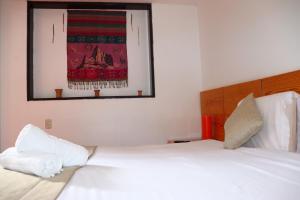 Letto o letti in una camera di Fenix Hotel Machupicchu