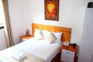 Letto o letti in una camera di Fenix Hotel Machupicchu