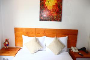 Letto o letti in una camera di Fenix Hotel Machupicchu
