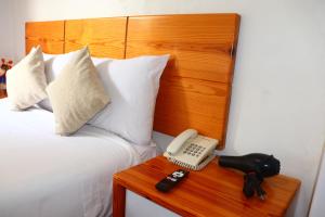 Letto o letti in una camera di Fenix Hotel Machupicchu