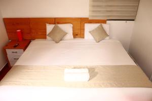 Letto o letti in una camera di Fenix Hotel Machupicchu
