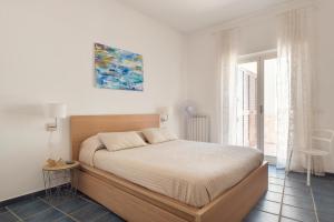 Ένα ή περισσότερα κρεβάτια σε δωμάτιο στο Blue54 - Pozzillo sul mare fra l'Etna e Taormina