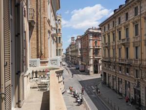 a city street with buildings and people walking on the street at Inappartamento La Pepita Luxury in Turin