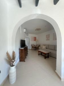 a living room with a couch and a table at Cozy bungalow in Calpe in Calpe