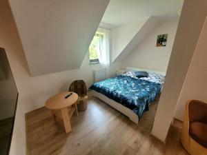 Postel nebo postele na pokoji v ubytování Dom Gościnny Harry