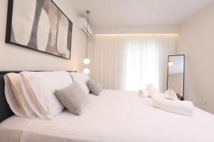 Postel nebo postele na pokoji v ubytování Olive Luxury Suite