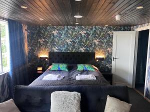 Postel nebo postele na pokoji v ubytování Beach House Ystad