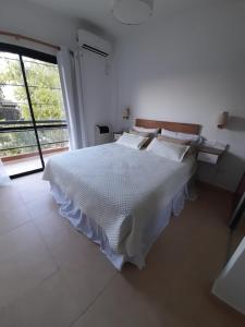 Ένα ή περισσότερα κρεβάτια σε δωμάτιο στο Puerto Soñado Norte