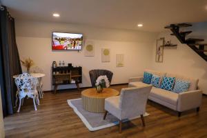 a living room with a couch and a table at Glamping Al Pie del Cerro in San Fernando