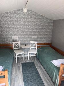 Postel nebo postele na pokoji v ubytování Beach House Ystad