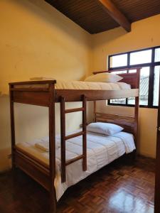 Postel nebo postele na pokoji v ubytování Casa Colon Quito Bed & Breakfast Hostel