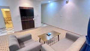 Χώρος καθιστικού στο Quel Serviced Units