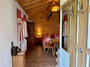 a hallway of a house with a dining room at Chalet Berghaus Rusch in Blaichach