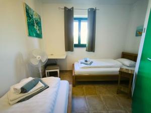 Postel nebo postele na pokoji v ubytování Villa Mikulica