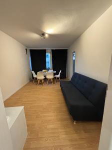 a living room with a couch and a table at Apartament Joanna in Kamienna Góra